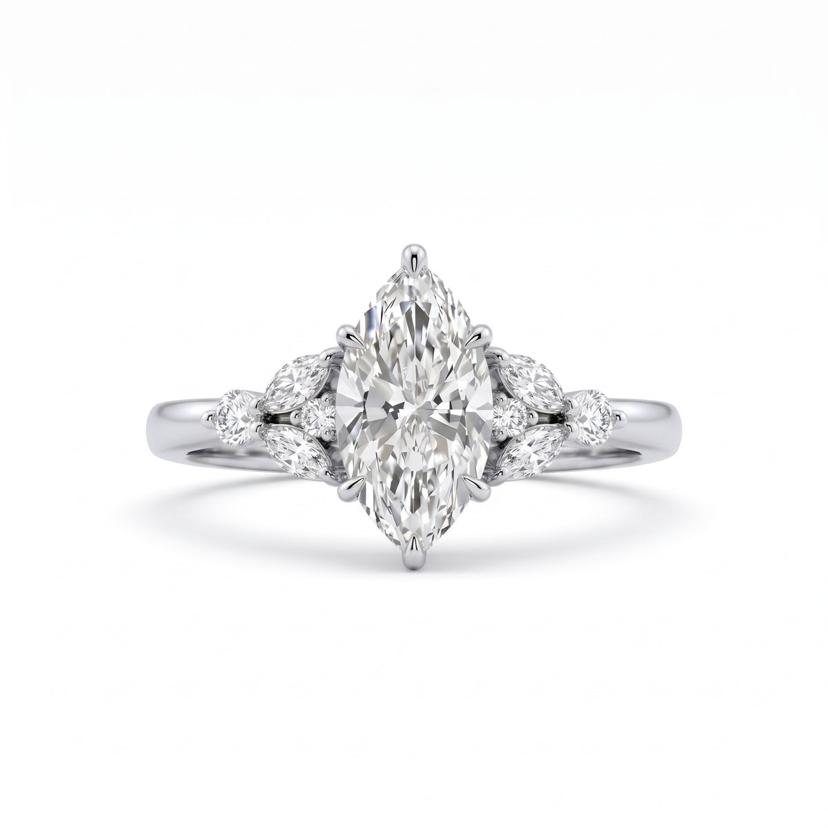 A silver-toned diamond ring featuring a marquise-cut center stone with smaller diamond accents on the shoulders, set against a clean white background.