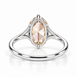Oval rose-cut lab-grown diamond solitaire engagement ring with a four-prong compass setting and sculpted white-metal band