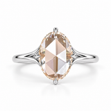 Oval rose-cut lab-grown diamond solitaire engagement ring with a four-prong compass setting and sculpted white-metal band