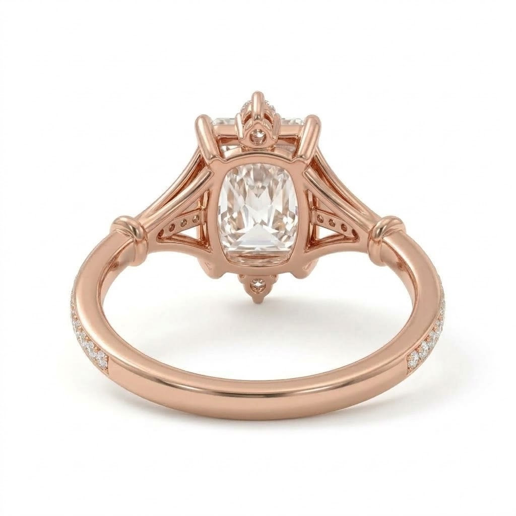 Radiant-cut engagement ring with pear-shaped accents above and below the center stone, pavé diamonds and polished white-metal split shoulders