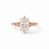 Radiant-cut engagement ring with pear-shaped accents above and below the center stone, pavé diamonds and polished white-metal split shoulders