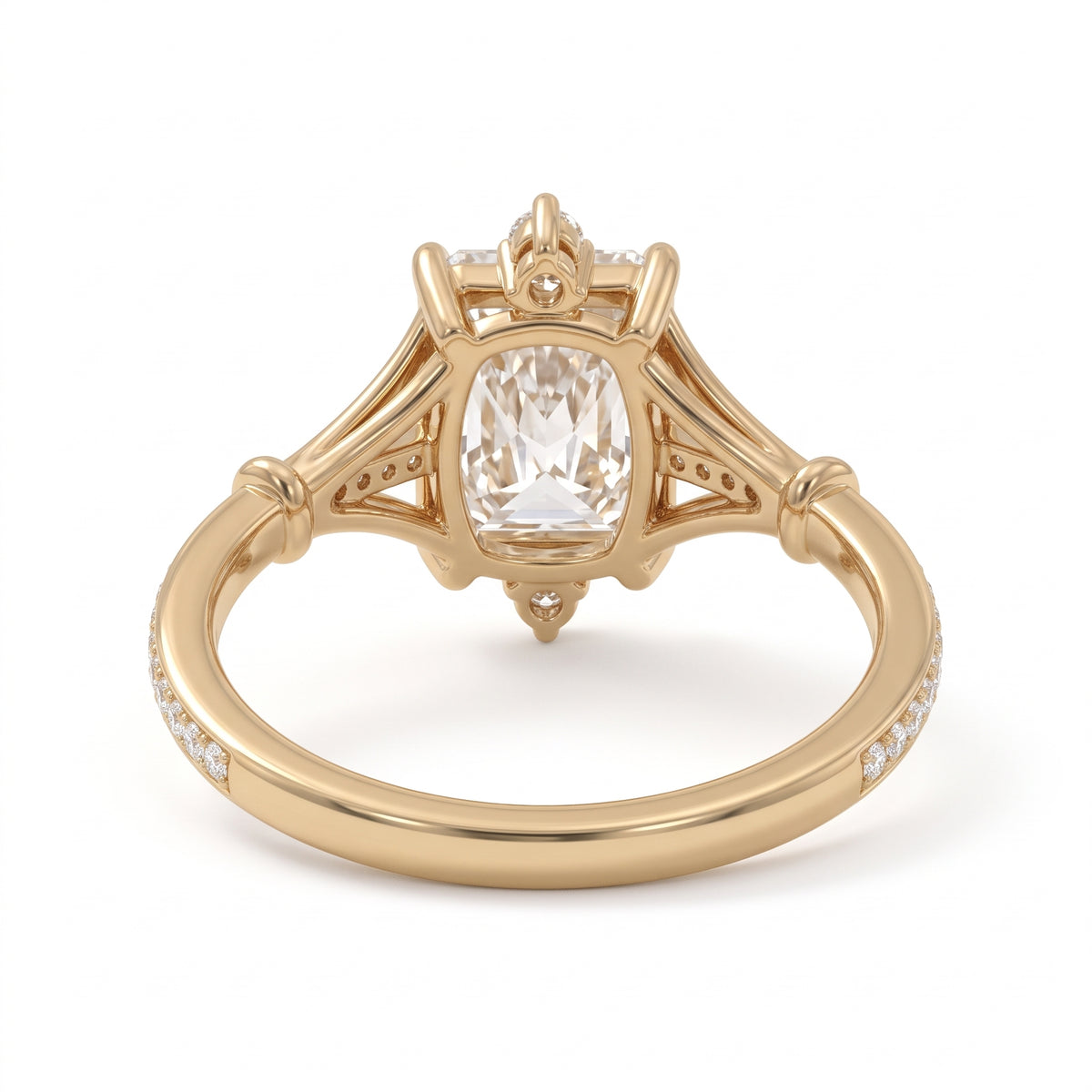 Radiant-cut engagement ring with pear-shaped accents above and below the center stone, pavé diamonds and polished white-metal split shoulders