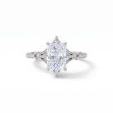 Radiant-cut engagement ring with pear-shaped accents above and below the center stone, pavé diamonds and polished white-metal split shoulders