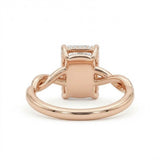 Radiant-cut engagement ring with four claw prongs and a twisted white-metal band combining polished and pavé-set strands