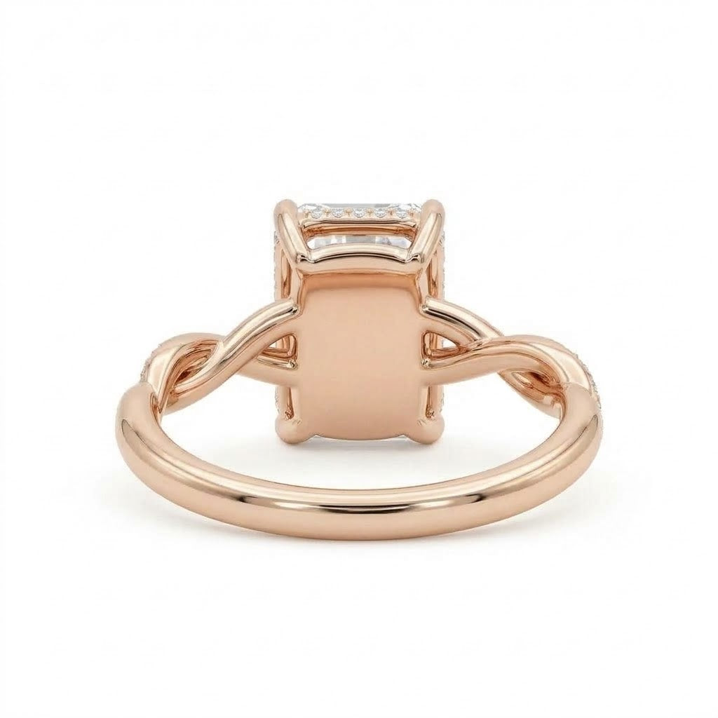 Radiant-cut engagement ring with four claw prongs and a twisted white-metal band combining polished and pavé-set strands