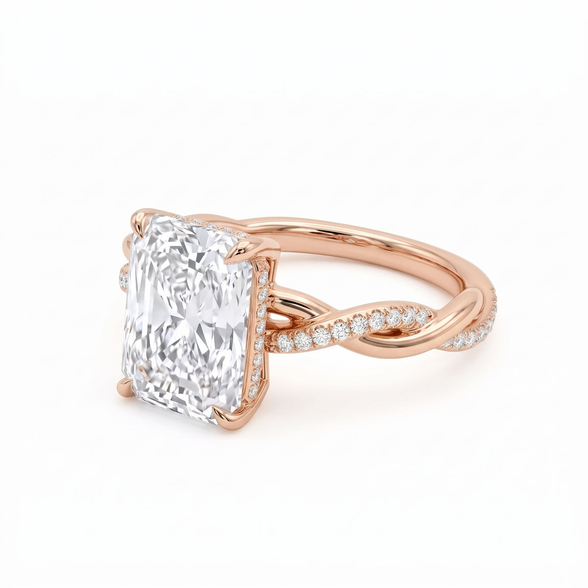 Radiant-cut engagement ring with four claw prongs and a twisted white-metal band combining polished and pavé-set strands
