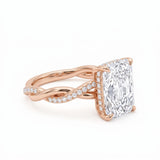 Radiant-cut engagement ring with four claw prongs and a twisted white-metal band combining polished and pavé-set strands