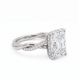 Radiant-cut engagement ring with four claw prongs and a twisted white-metal band combining polished and pavé-set strands