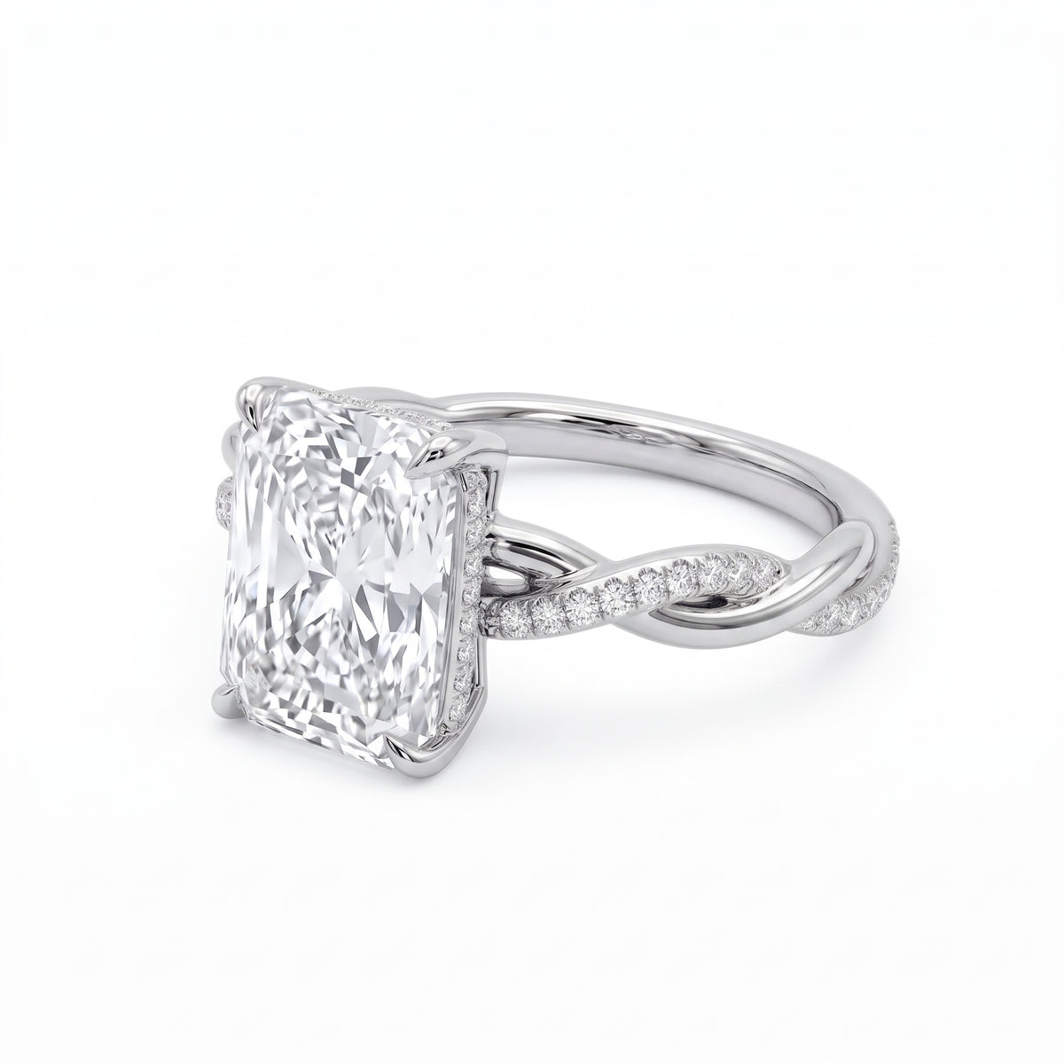 Radiant-cut engagement ring with four claw prongs and a twisted white-metal band combining polished and pavé-set strands