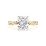 Radiant-cut engagement ring with four claw prongs and a twisted white-metal band combining polished and pavé-set strands