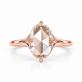 Oval rose-cut lab-grown diamond solitaire engagement ring with a four-prong compass setting and sculpted white-metal band