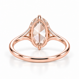 Oval rose-cut lab-grown diamond solitaire engagement ring with a four-prong compass setting and sculpted white-metal band