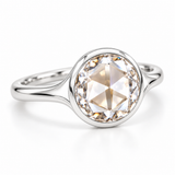 Round rose-cut lab-grown diamond solitaire ring with a smooth bezel setting and sculpted polished white-metal band