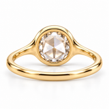 Round rose-cut lab-grown diamond solitaire ring with a smooth bezel setting and sculpted polished white-metal band