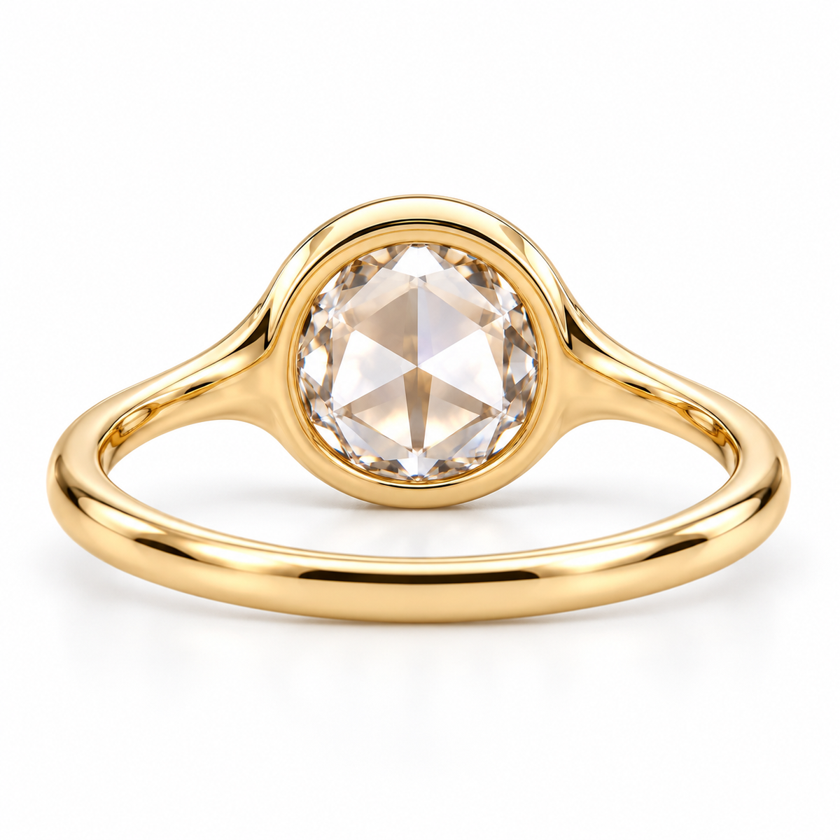 Round rose-cut lab-grown diamond solitaire ring with a smooth bezel setting and sculpted polished white-metal band