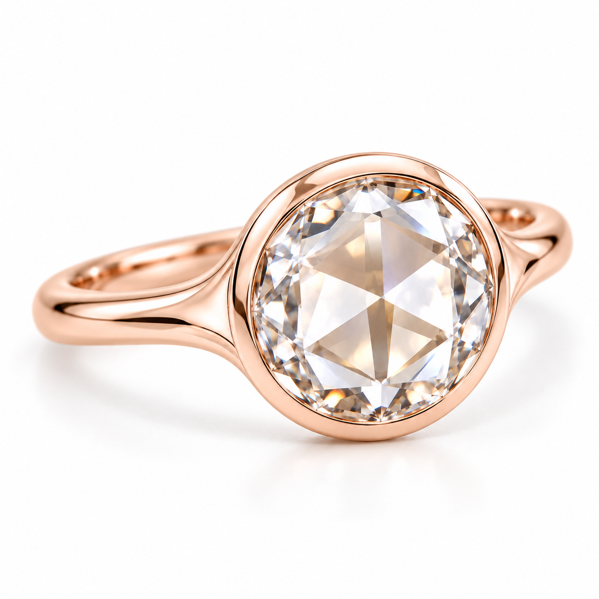 Round rose-cut lab-grown diamond solitaire ring with a smooth bezel setting and sculpted polished white-metal band